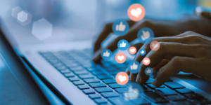 hands typing on laptop